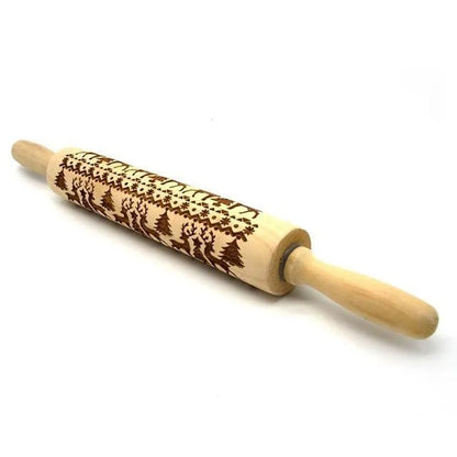 Wooden rolling pin with engraved Christmas patterns including reindeer and snowflakes on a 45cm long barrel.