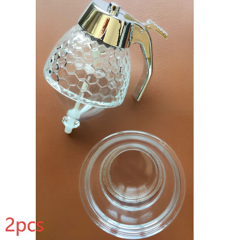 Transparent kitchen honey dispenser showing 200ml capacity with measurements 8.3x10x15cm