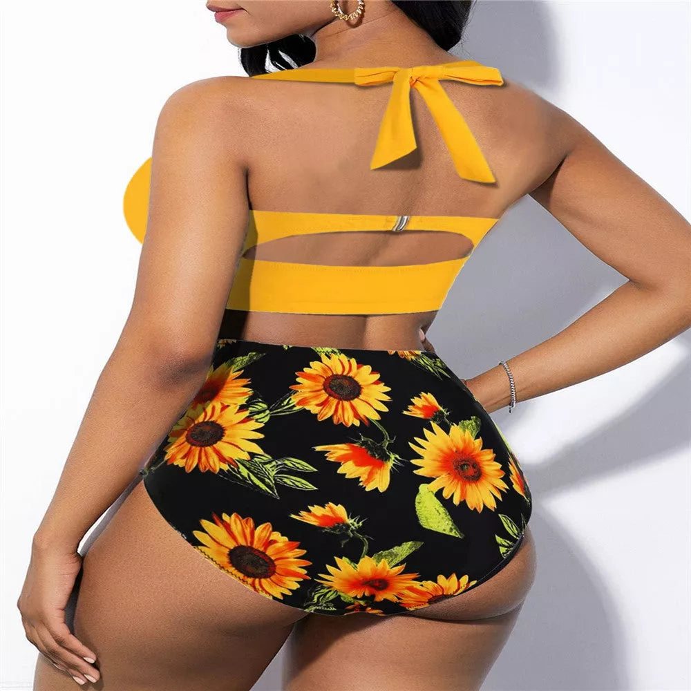 High-waisted plus-size swimsuit with yellow and black floral patterns