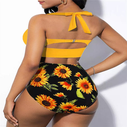 High-waisted plus-size swimsuit with yellow and black floral patterns