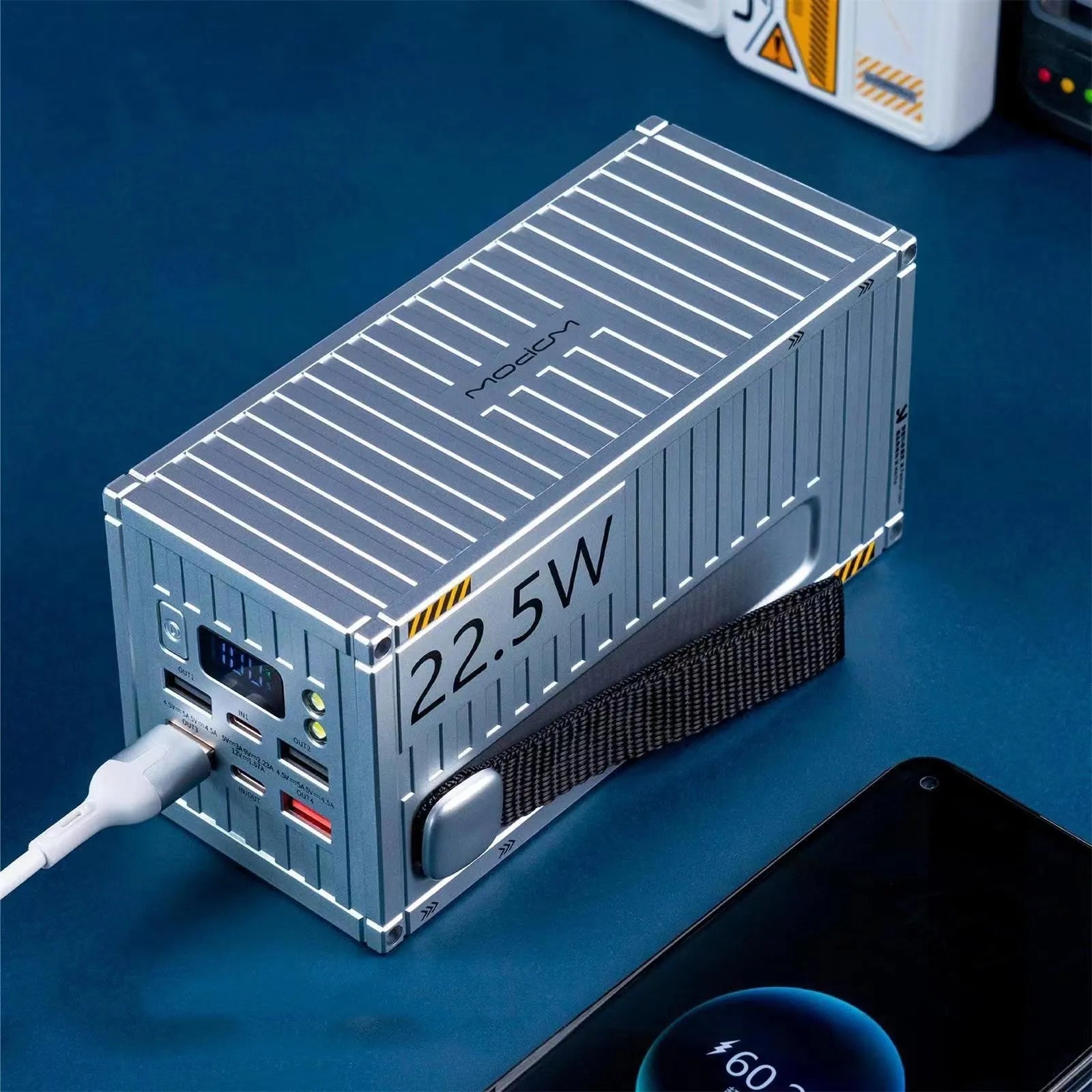 Yellow 50000mAh portable power bank with digital display showing battery percentage and multiple USB ports.
