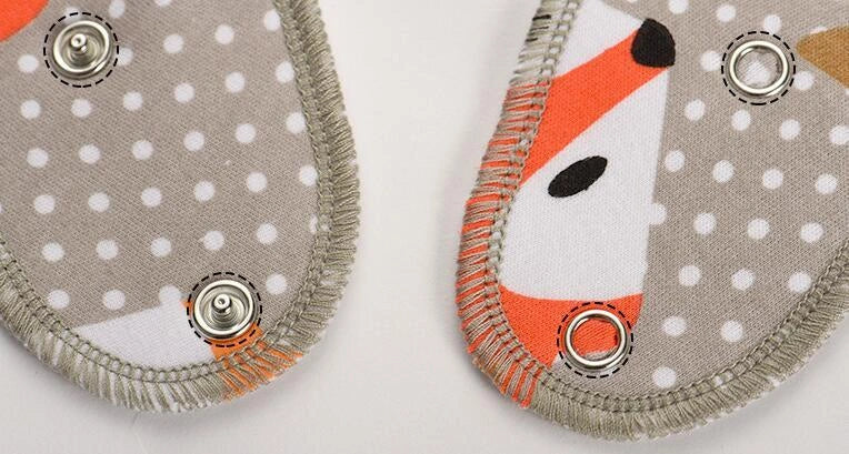Stylish baby bibs and burp cloths featuring trendy arrow, wave, and triangle designs in soft, absorbent cotton