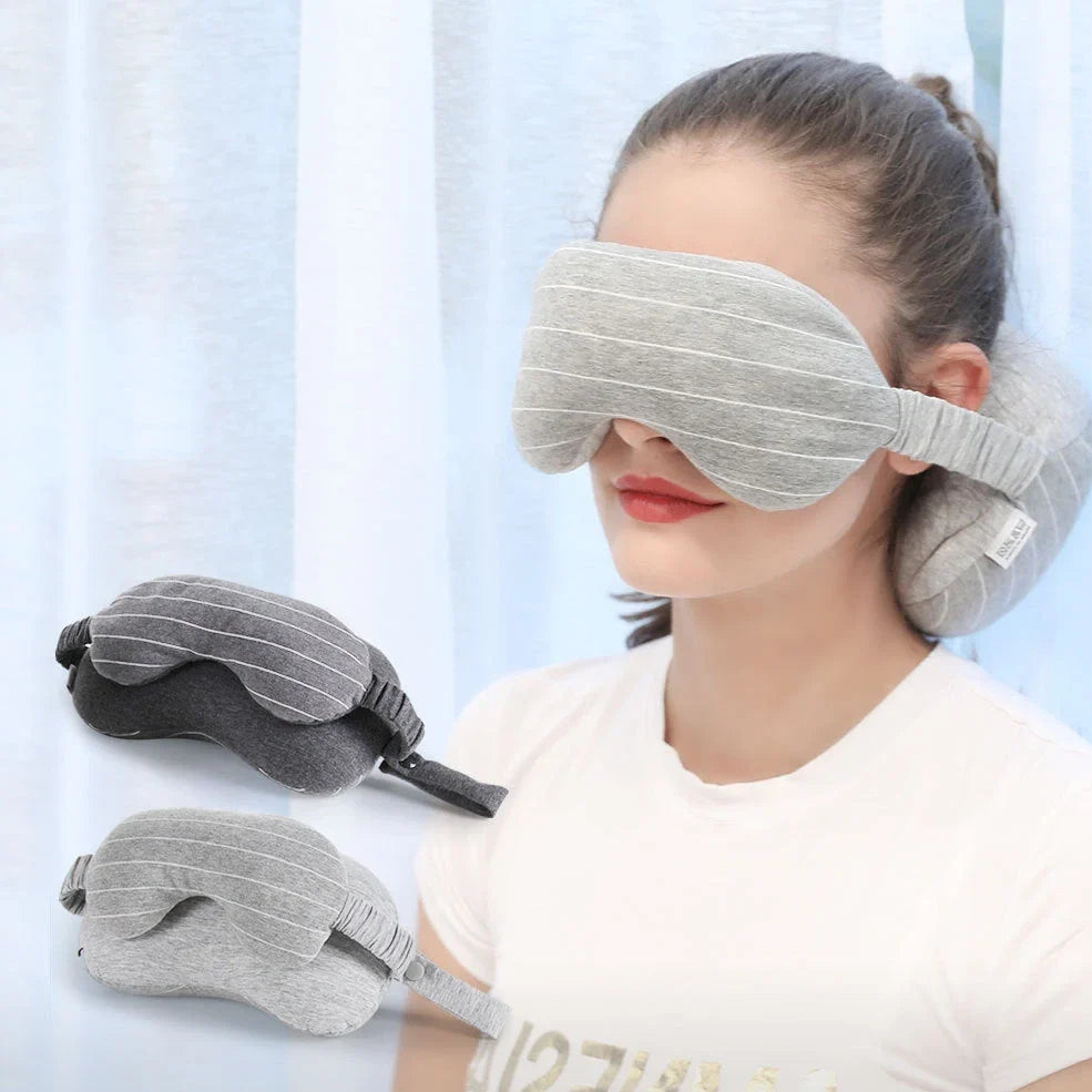 Dark grey two-in-one pillow showing neck support position and eye mask function with 24cm length measurement