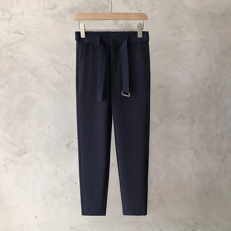 Boys slim straight wool trousers in a tapered fit, shown in a light grey colour.