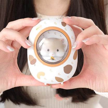 White Hamster space capsule design hand warmer and power bank unit showing its compact size.