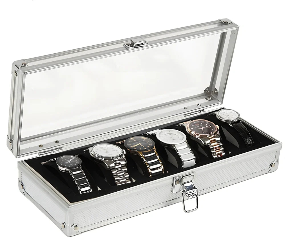 Aluminium watch storage box with clear lid showing six velvet-lined compartments for watch collection