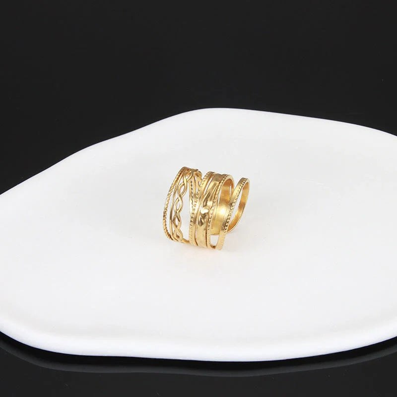 Adjustable stainless steel finger ring with unique charm designs in various colors