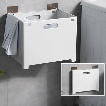 White wall-mounted bathroom storage cabinet with integrated table surface for laundry organisation