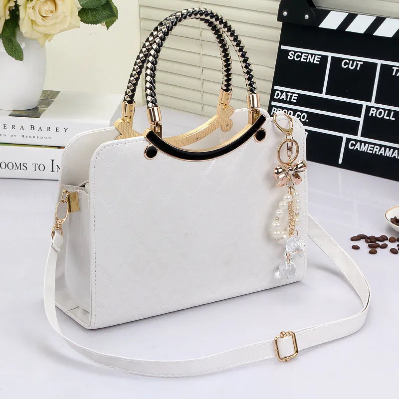 Lingge PU square shoulder bag for women with rhombic quilted design, zip opening, and hard handle.