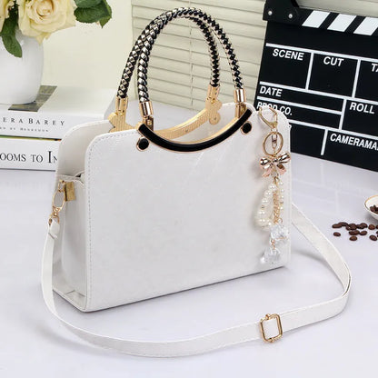 Lingge PU square shoulder bag for women with rhombic quilted design, zip opening, and hard handle.