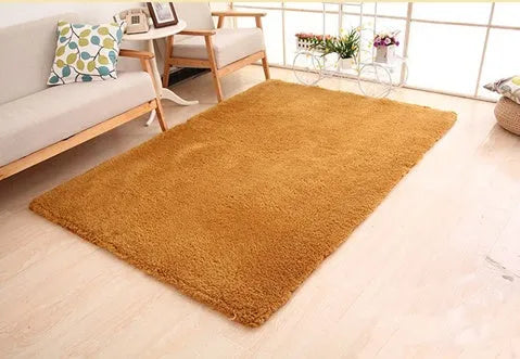 Solid colour plush area rug showing velvet pile texture and rectangular shape