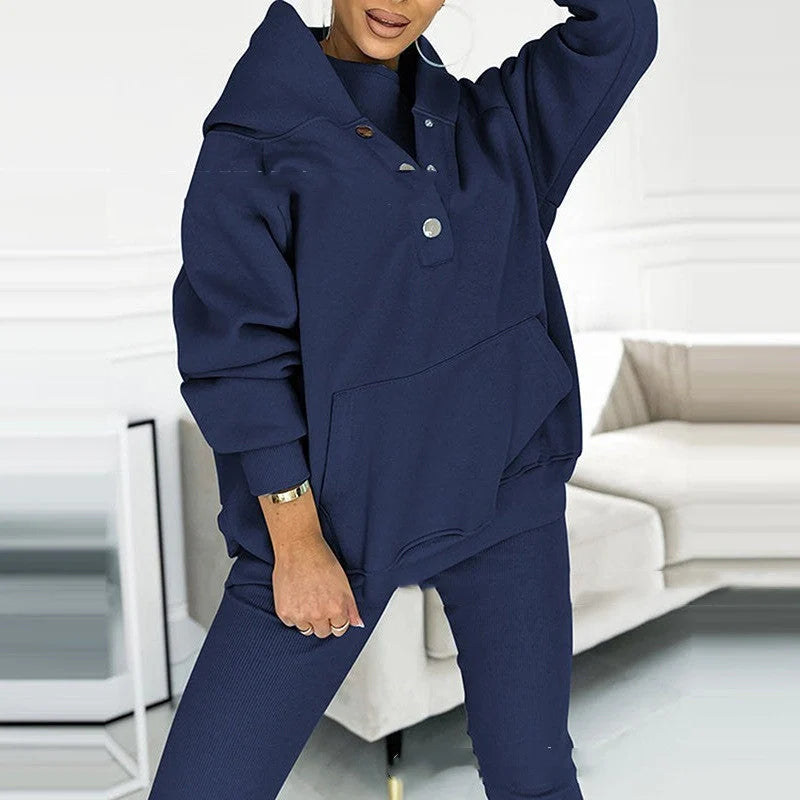Women's 3-piece sports suit featuring a hooded sweatshirt with pockets and slim trousers