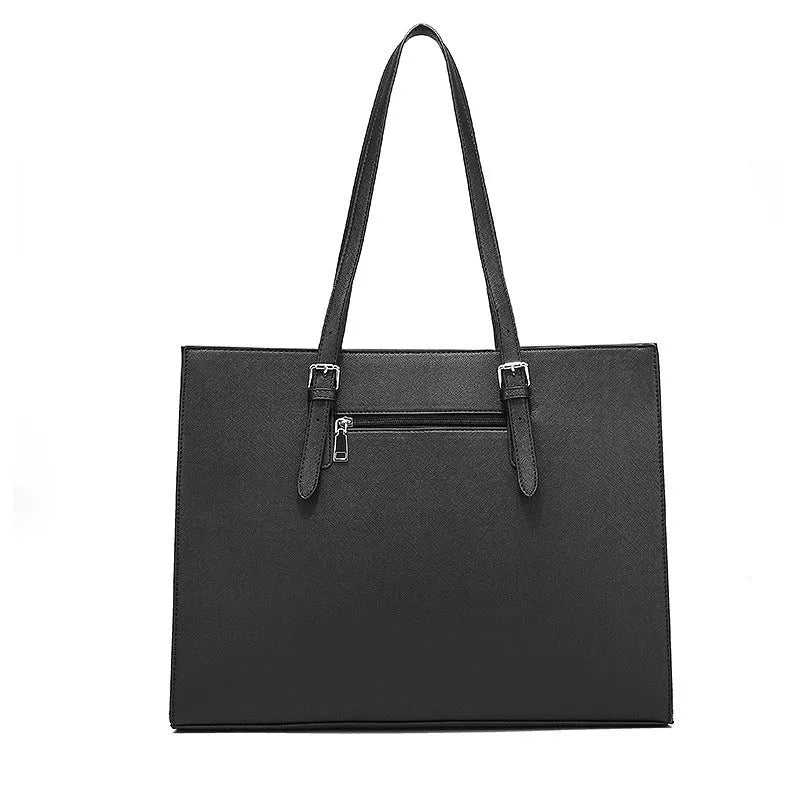 Black women's business computer bag with three shoulder straps showing internal organisation compartments