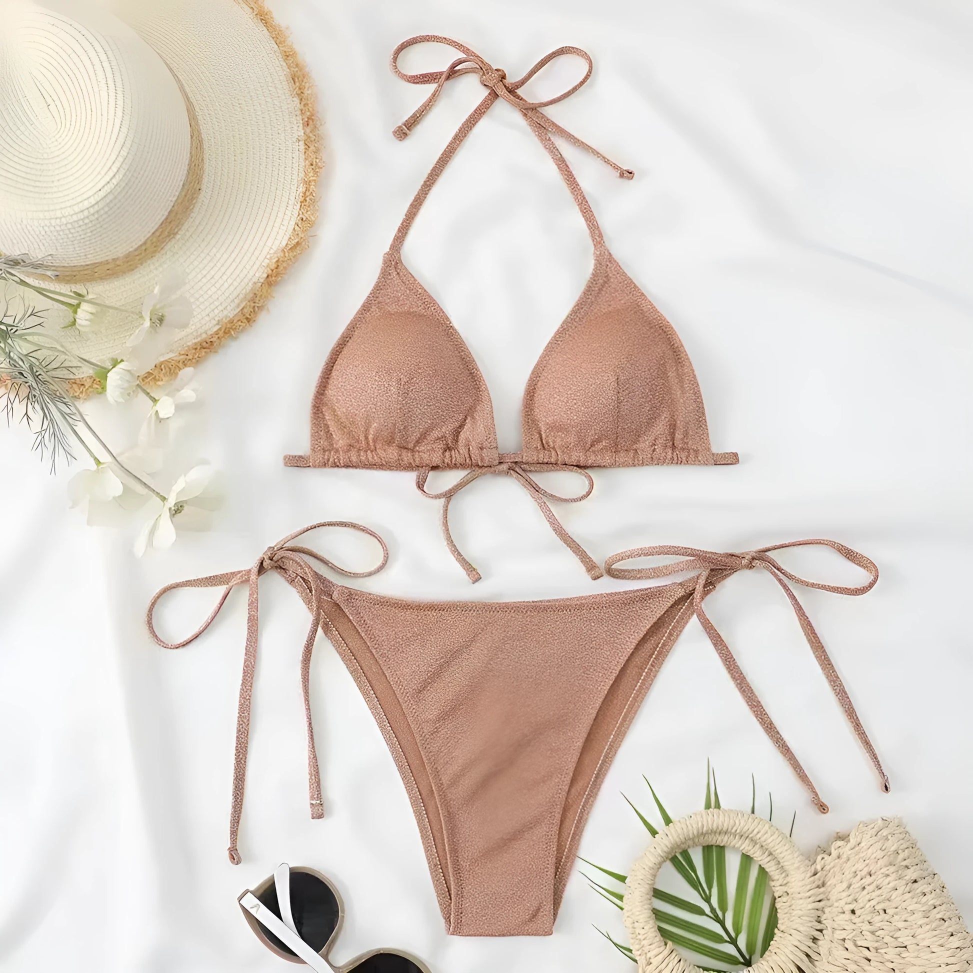 Khaki gold women's two-piece bandage swimsuit with a criss-cross back design on a mannequin.