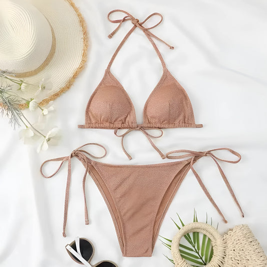 Khaki gold women's two-piece bandage swimsuit with a criss-cross back design on a mannequin.