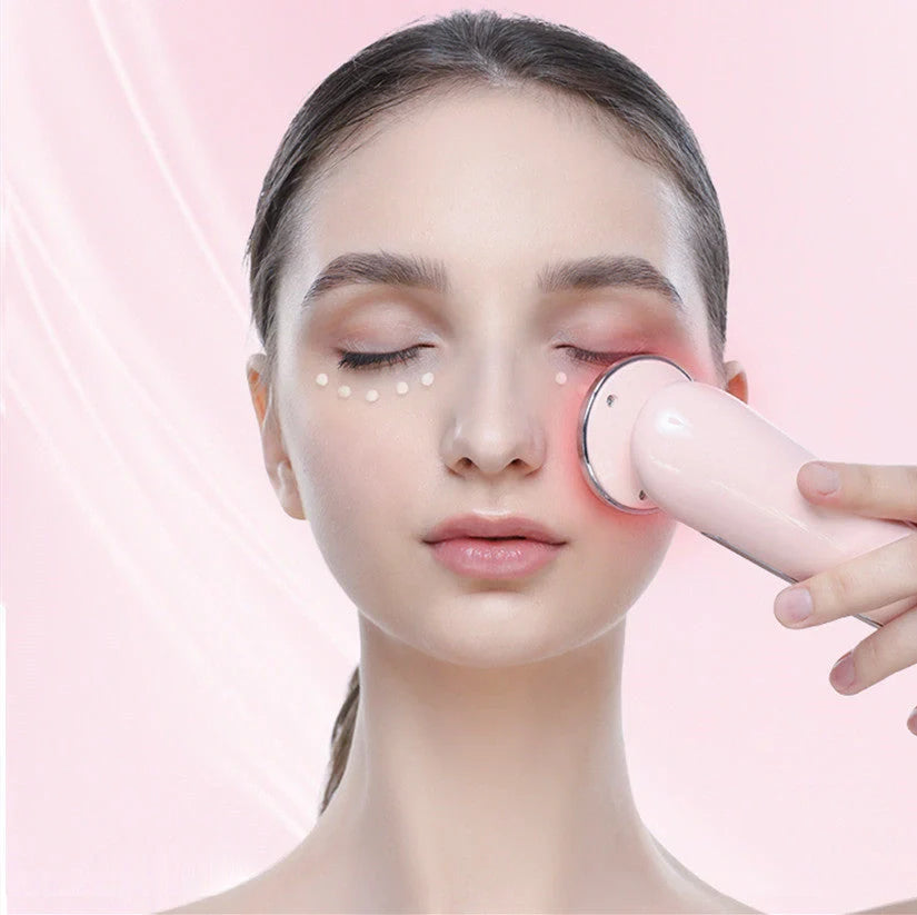 Pink and white facial massager for deep pore cleansing and skin rejuvenation with light therapy