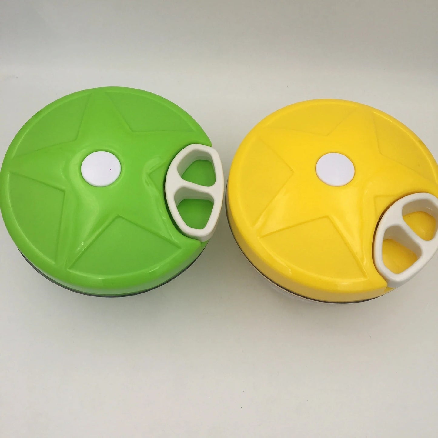 Manual vegetable fruit shredder with stainless steel blade on kitchen counter