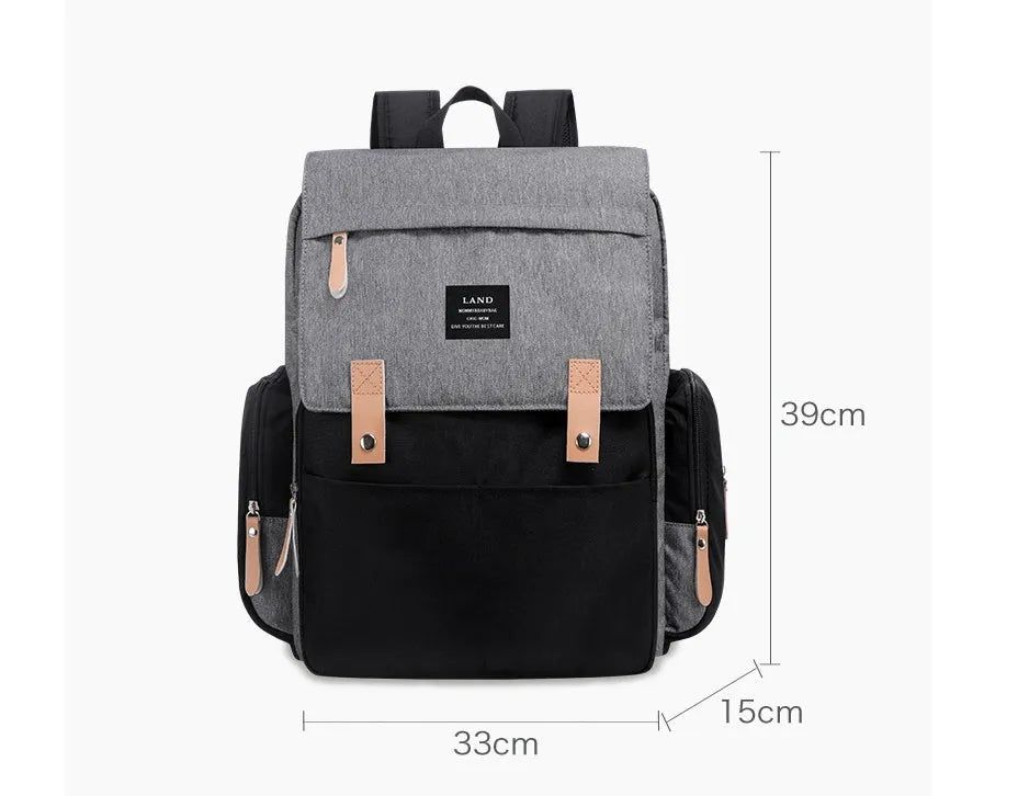 LAND Mommy large grey diaper backpack with changing mat, shown as a travel nappy bag.