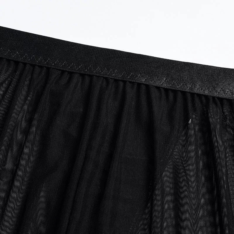 Solid black sling bikini set for women, includes bra, jacket, skirt, and shorts