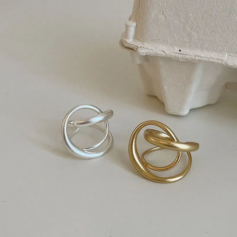 Geometric open ring with interlaced pattern and matte finish, adjustable for finger sizes 16mm to 20mm