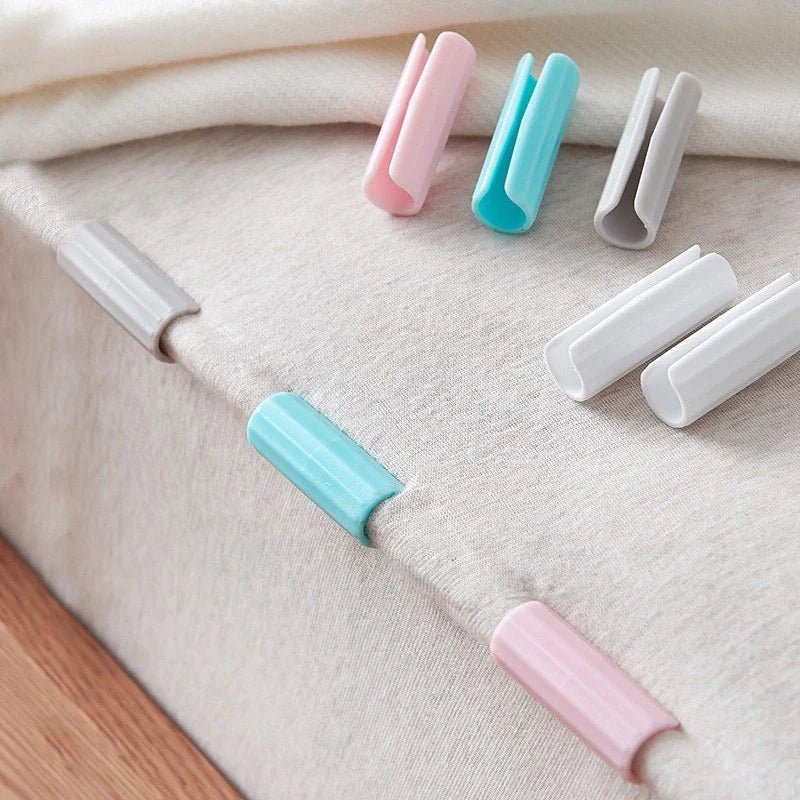 Non-slip sheet clips in various colors securing bedding neatly in place