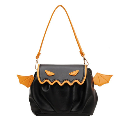 Halloween pumpkin cartoon crossbody bag with small wings in black, white, and orange