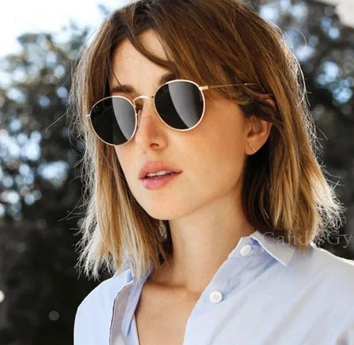Stylish women's retro sunglasses with round frame and metal finish