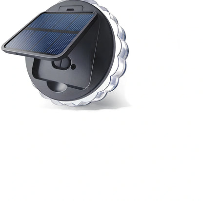 Round solar garden wall light with 9 LED lights mounted on wooden fence