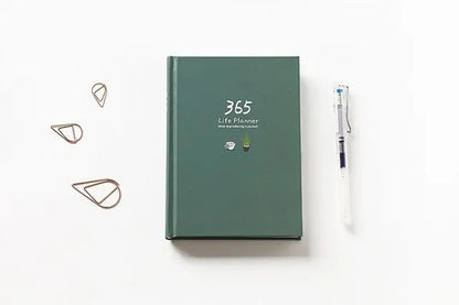 Hardback 365 day planner notebook, 13.5 x 18.2cm, 228 pages, 100gsm white cattle paper, Dark Green or Pink