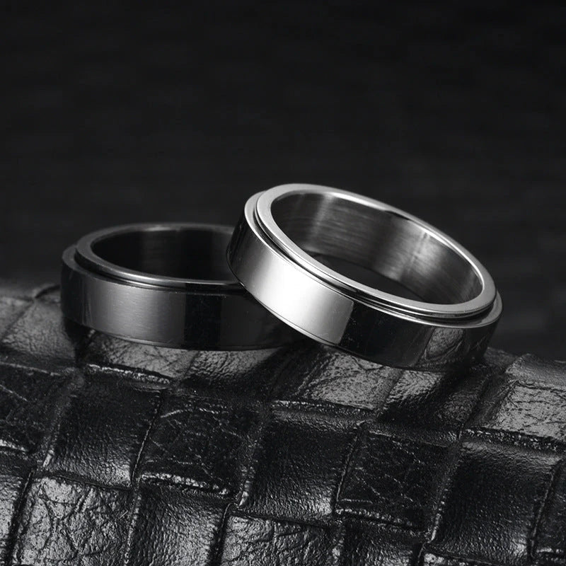 Stainless steel spinner ring with intricate moon and stars design