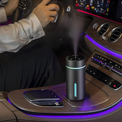 Black aluminium portable car humidifier and essential oil diffuser with night light on desk