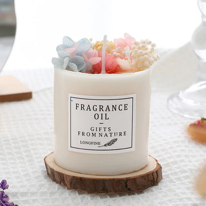 Aromatherapy candle with dried flowers on a wooden chip base, showing blue campanula and lavender scent options.
