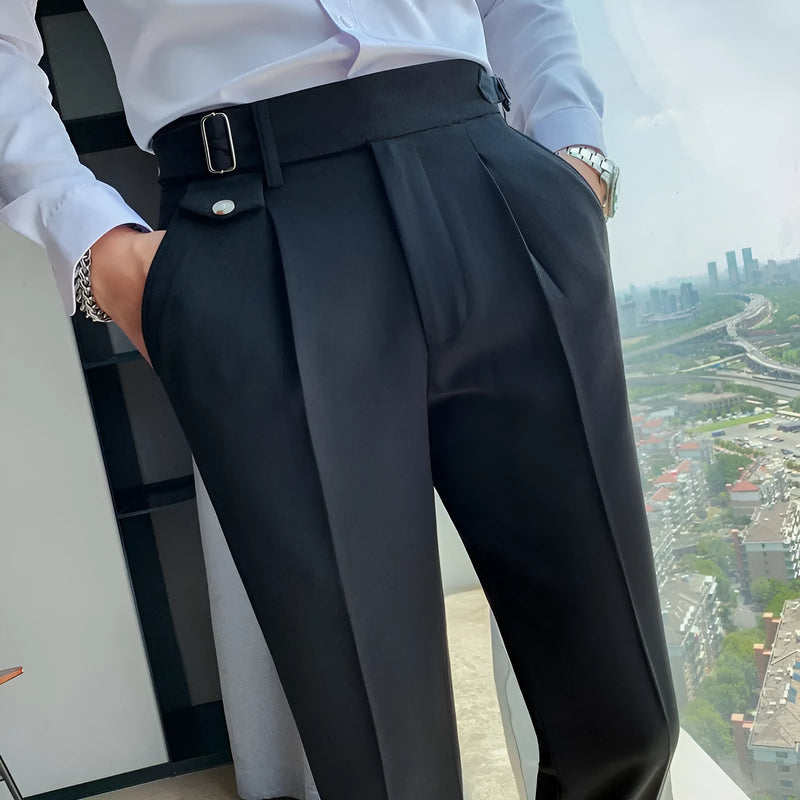 Straight-leg casual trousers in solid colours with a classic fit, available in waist sizes from 29 to 36 inches across multiple colourways including black, grey, and khaki.