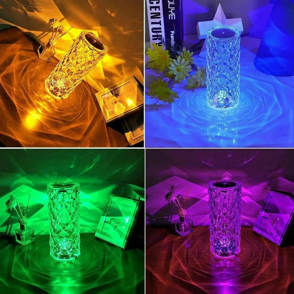 Clear acrylic LED table lamp with diamond-cut surfaces and remote control on wooden surface
