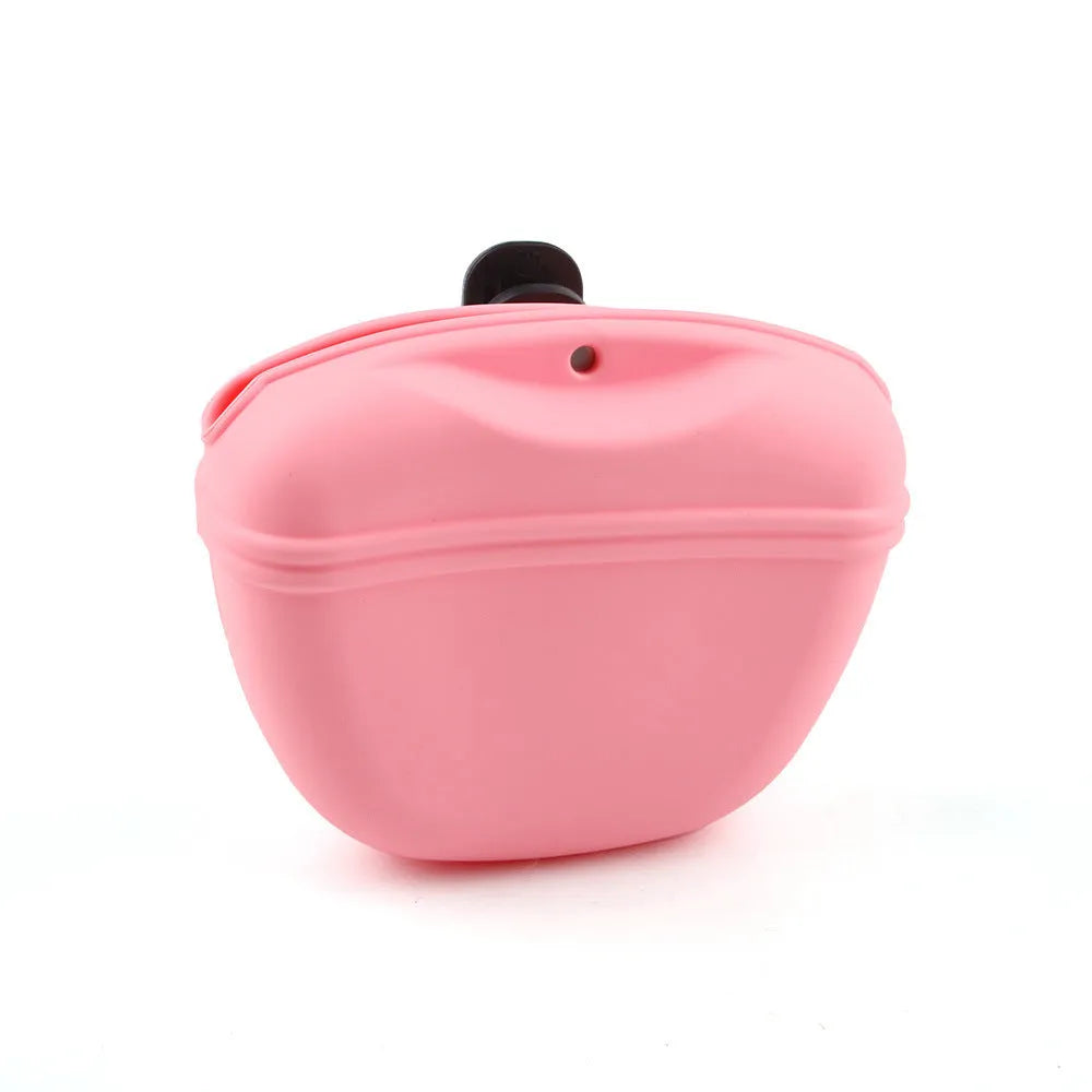 Black silicone dog training treat pouch with clip and magnetic closure shown attached to a belt.