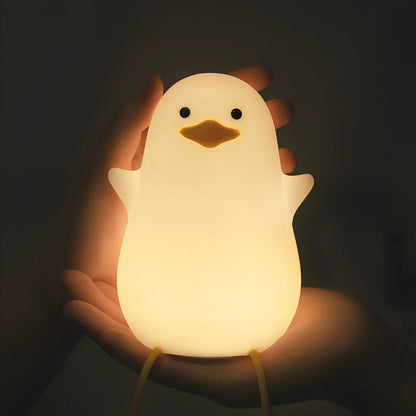 Seagull-shaped silicone night light in blue or yellow measuring 96.5×91×130mm with tap controls