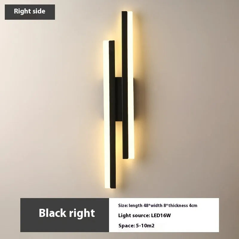 Scandinavian minimalist LED wall light with acrylic shade and adjustable arm in black or gold finish.
