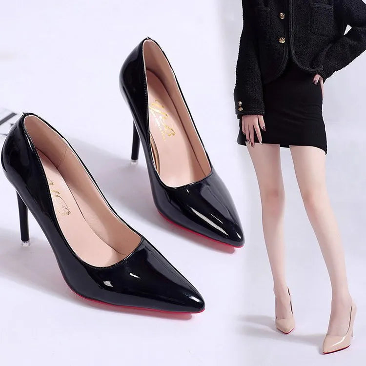 Women's black stiletto heel pumps with pointed toe and shallow mouth design on a neutral background