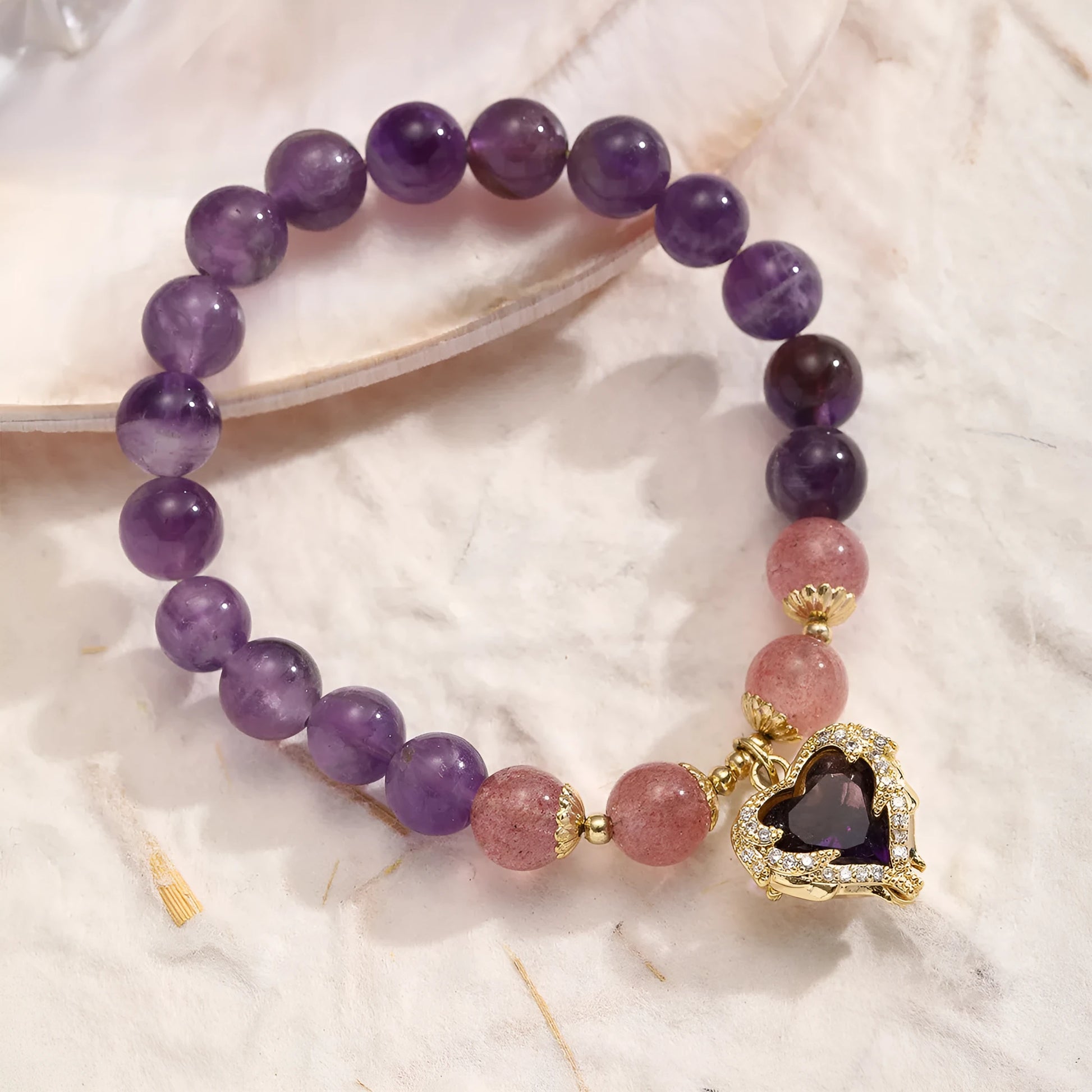 Retro-style stone bracelet for women with a silver peace buckle on a wrist.
