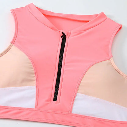 Pink high-waist split bikini swimsuit with briefs style and sleeveless design on mannequin