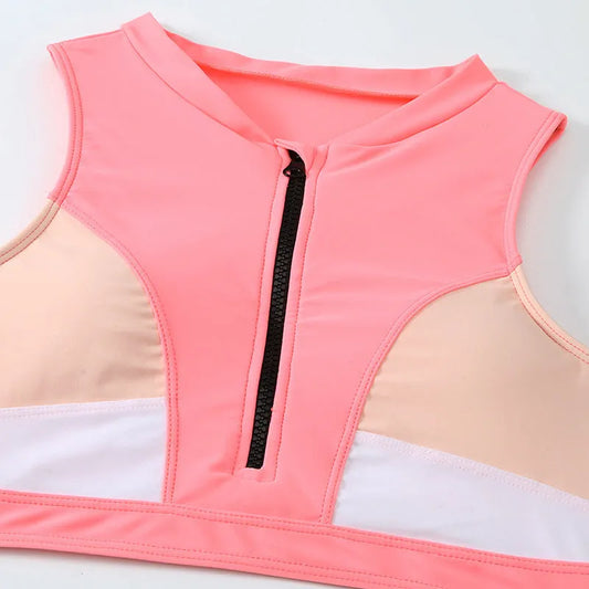 Pink high-waist split bikini swimsuit with briefs style and sleeveless design on mannequin