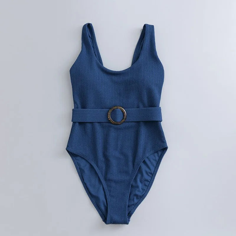 Navy blue women's one-piece swimsuit with triangle top and built-in chest pads for swimming