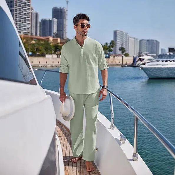 Men's casual cotton long sleeve trousers suit in solid colours on a hanger.