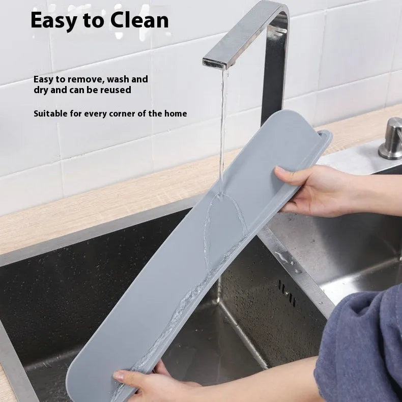 Grey silicone sink water blocking plate showing 52mm height and 85mm length dimensions