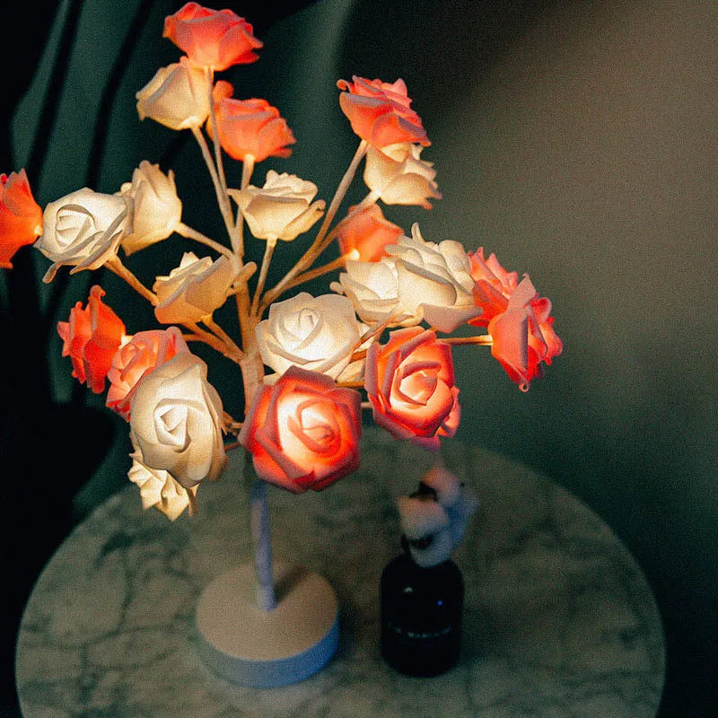 White and red rose flower LED lamp on a bonsai tree stand with warm white lights.