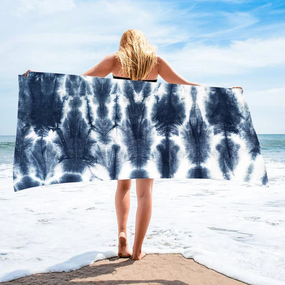 Square beach towel with tie-dye pattern showing superfine fibre texture and vibrant colours