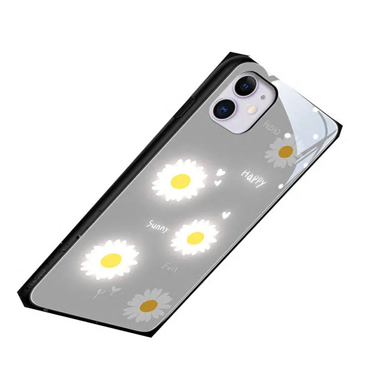 Luminous phone case with voice-activated colour lights showing painted daisy design on Apple iPhone