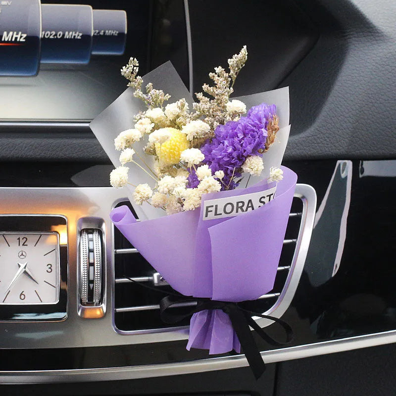 Mini dried flower bouquet mounted in car air vent for decorative aromatherapy