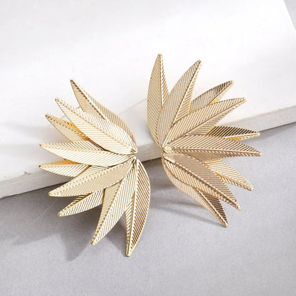 Gold and white alloy leaf-shaped patch earrings with dangle design