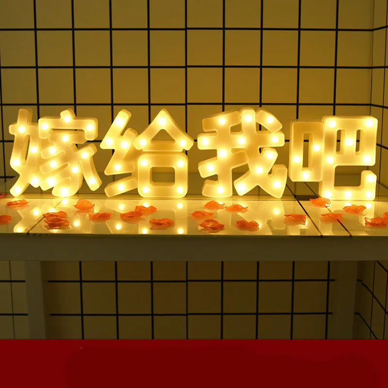 Plastic LED alphabet letter light spelling a message for a birthday or proposal.